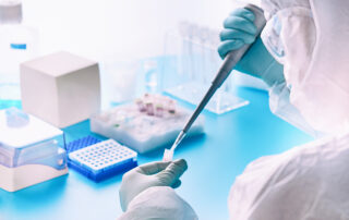 A lab worker performs a molecular diagnostic PCR test