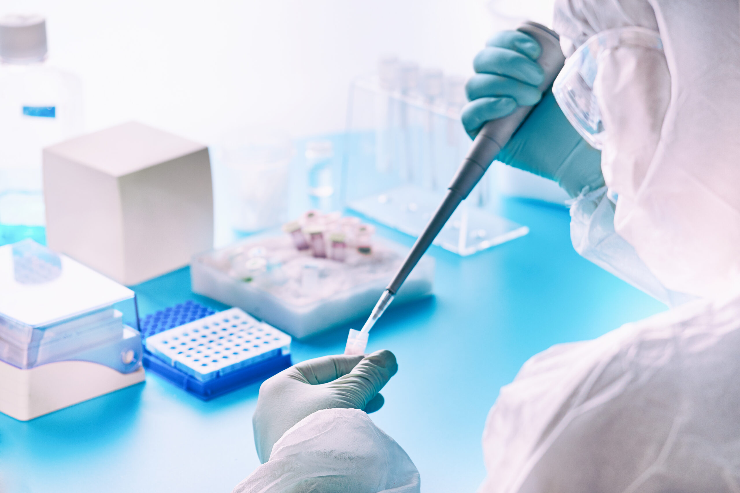 A lab worker performs a molecular diagnostic PCR test
